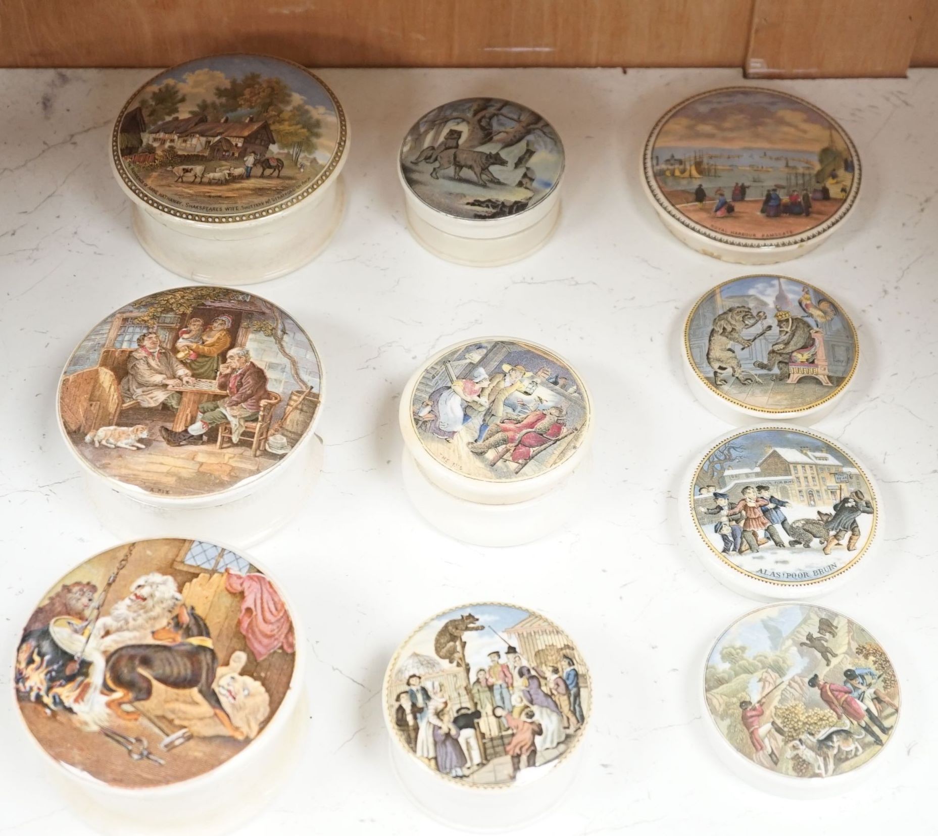 Ten Victorian pot lids including six bear's grease, largest 10.5 cms diameter.